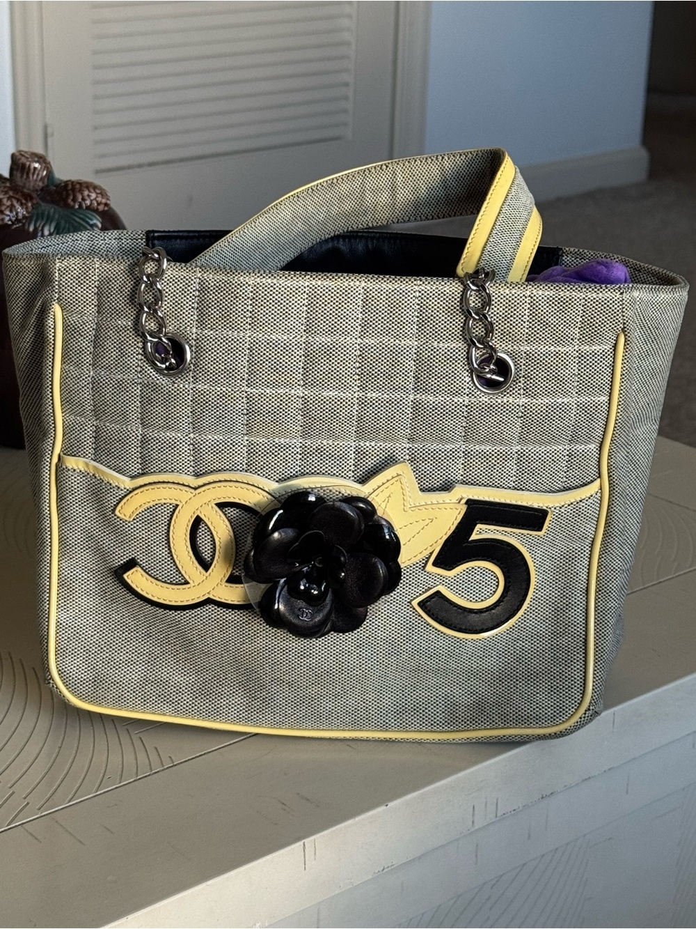 CHANEL Gray Canvas Shoulder Bag with Yellow Trim and Black Camellia